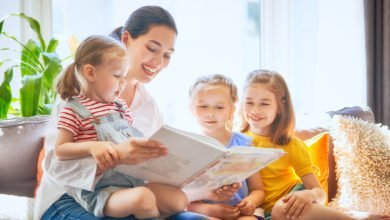 mom-and-children-reading-a-book-happy